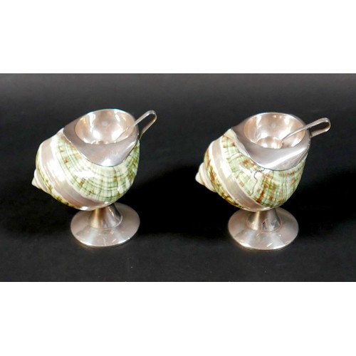 95 - An unusual pair of novelty salts, formed from decorative seashells, each mounted with a white metal ... 