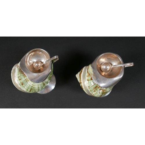 95 - An unusual pair of novelty salts, formed from decorative seashells, each mounted with a white metal ... 