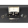 A group of silver items, comprising a three piece cruet set, Mappin & Webb, Birmingham 1957, with tw... 