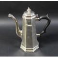 A George V silver coffee pot, tapering octagonal design with scroll spout, Carrington & Co, London 1... 