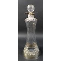 A Victorian decanter and stopper with silver applied scroll work, William Comyns & Sons, London 1904... 