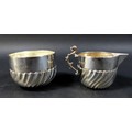 A Victorian matching sugar bowl and milk jug, marked Wakely & Wheeler, London 1897, total weight 3.9... 