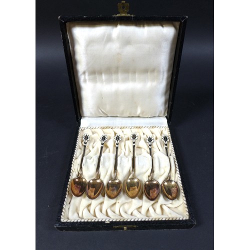 32 - A set of six silver gilt and enamel coffee spoons, in case, marked '925 S. G. G.', total weight 1.48... 