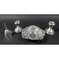 Three pieces of silver, comprising a pair of dwarf candle holders, marked W I Broadway & Co, Birming... 