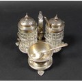 A Victorian cruet set, standing on three pad feet with scrolling handle, Henry Wilkinson & Co, Sheff... 