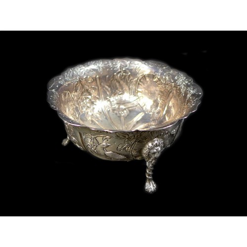 58 - A Victorian silver bowl decorated with birds and animals with lion-topped legs, Wakely & Wheeler, Lo... 