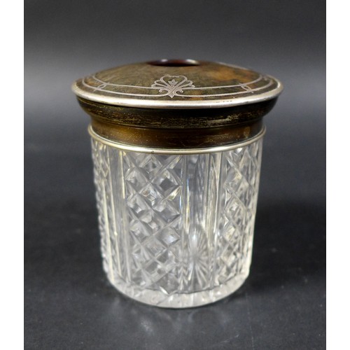 29 - A pair of Victorian canisters, comprising a silver canister with ornate decoration, London 1901, and... 