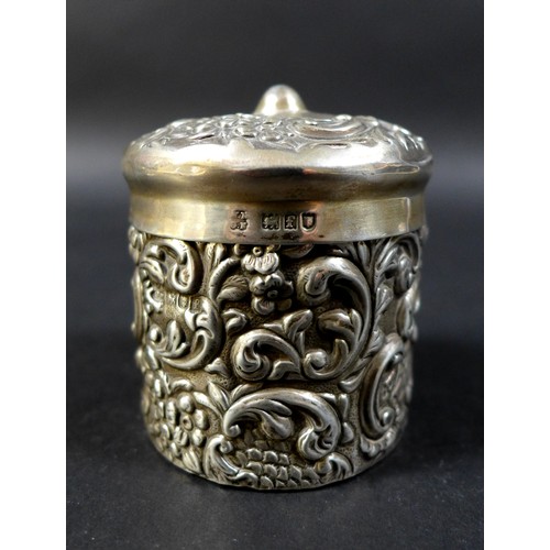 29 - A pair of Victorian canisters, comprising a silver canister with ornate decoration, London 1901, and... 