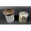 A pair of Victorian canisters, comprising a silver canister with ornate decoration, London 1901, and... 
