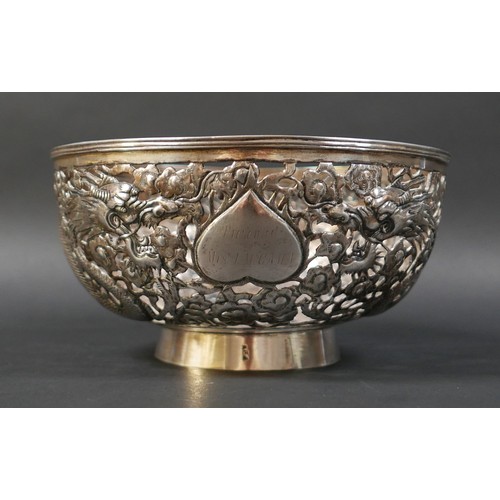 101 - A Chinese Export silver bowl, circa 1900, the body pierced and decorated in relief with a pair of fa... 