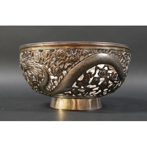 101 - A Chinese Export silver bowl, circa 1900, the body pierced and decorated in relief with a pair of fa... 