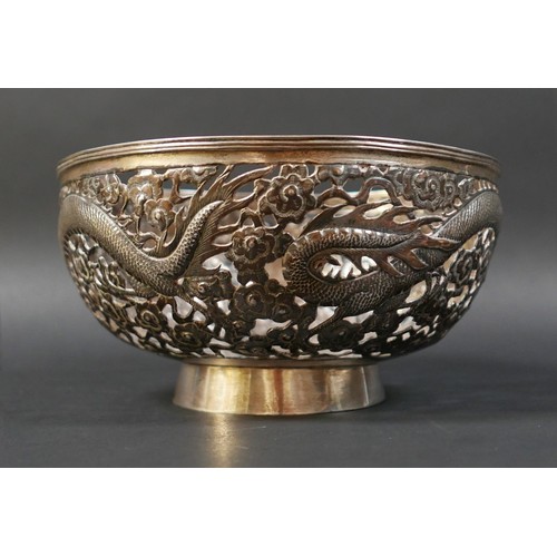 101 - A Chinese Export silver bowl, circa 1900, the body pierced and decorated in relief with a pair of fa... 