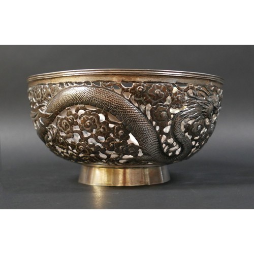 101 - A Chinese Export silver bowl, circa 1900, the body pierced and decorated in relief with a pair of fa... 