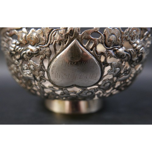 101 - A Chinese Export silver bowl, circa 1900, the body pierced and decorated in relief with a pair of fa... 