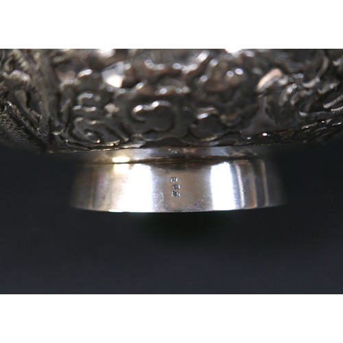 101 - A Chinese Export silver bowl, circa 1900, the body pierced and decorated in relief with a pair of fa... 