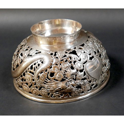 101 - A Chinese Export silver bowl, circa 1900, the body pierced and decorated in relief with a pair of fa... 