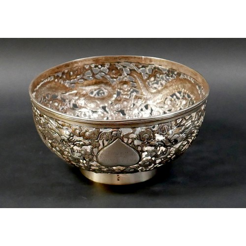 101 - A Chinese Export silver bowl, circa 1900, the body pierced and decorated in relief with a pair of fa... 