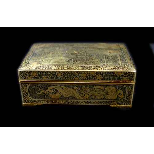 102 - A Japanese Komai type box, with hinged cover and stay chain, the exterior finely decorated in gilt w... 