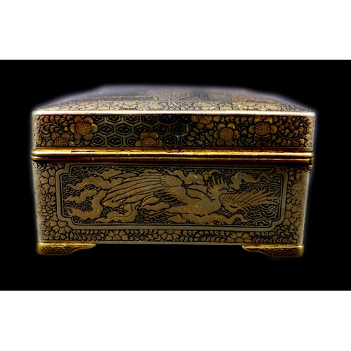 102 - A Japanese Komai type box, with hinged cover and stay chain, the exterior finely decorated in gilt w... 