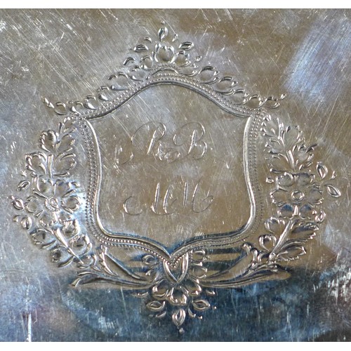 79 - A George III silver teapot stand, of oval form, with engraved wrigglework borders and central foliat... 