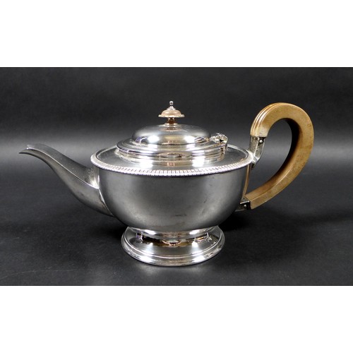 120 - A George V silver teapot and hot water pot, with gadrooned decoration, 13.5 and 19.5cm high, Cooper ... 