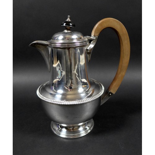 120 - A George V silver teapot and hot water pot, with gadrooned decoration, 13.5 and 19.5cm high, Cooper ... 