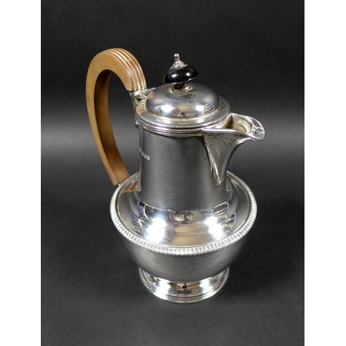 120 - A George V silver teapot and hot water pot, with gadrooned decoration, 13.5 and 19.5cm high, Cooper ... 