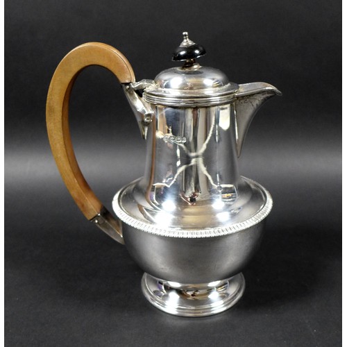 120 - A George V silver teapot and hot water pot, with gadrooned decoration, 13.5 and 19.5cm high, Cooper ... 