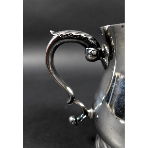 24 - A small George V / VI silver tankard, of baluster form with foliate thumb rest, probably M Beaver Lt... 