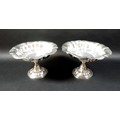A pair of Victorian silver pedestal bowls, each of lobed oval form raised on a stepped and shaped ci... 