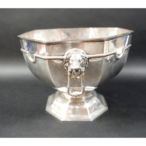 131 - A George V silver pedestal bowl, of with octagonal rim tapering to a pedestal foot, twin lion’s head... 