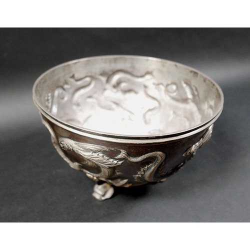 125 - An Edward VII Irish silver bowl, repoussé decorated with flying fish, plannished base, raised on thr... 