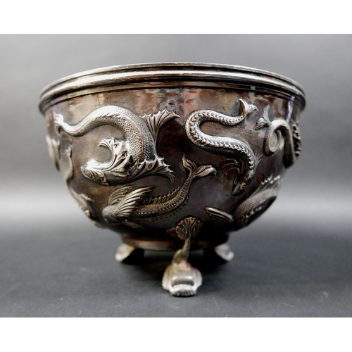 125 - An Edward VII Irish silver bowl, repoussé decorated with flying fish, plannished base, raised on thr... 