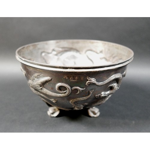 125 - An Edward VII Irish silver bowl, repoussé decorated with flying fish, plannished base, raised on thr... 