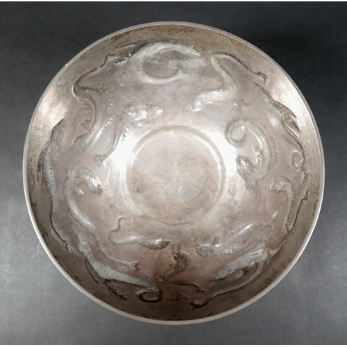 125 - An Edward VII Irish silver bowl, repoussé decorated with flying fish, plannished base, raised on thr... 