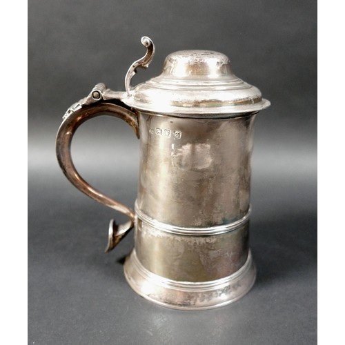132 - A George III silver lidded tankard, of tapering cylindrical form with moulded girdle, the domed lid ... 