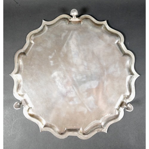 123 - An Edward VII silver tray, of scalloped circular form, and raised on three feet, Elkington & Co Ltd,... 