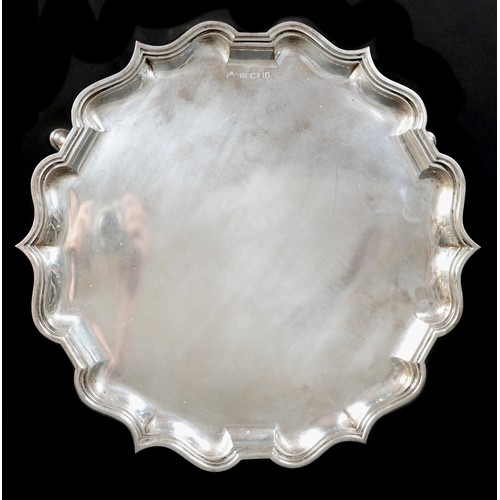 123 - An Edward VII silver tray, of scalloped circular form, and raised on three feet, Elkington & Co Ltd,... 