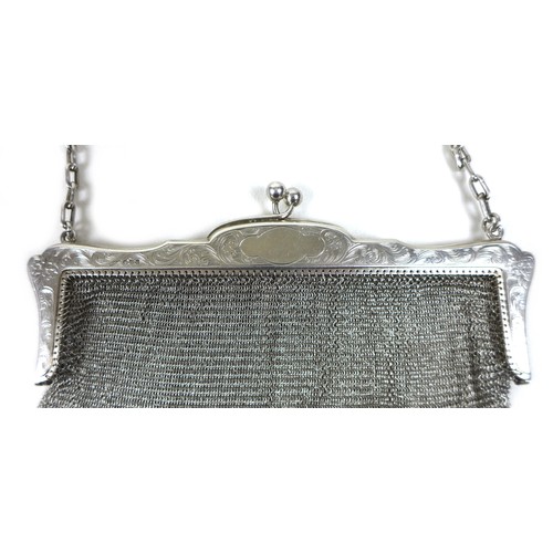 70 - An early 20th century silver ladies chainmail bag, floral engraved frame with chainmail link bag and... 