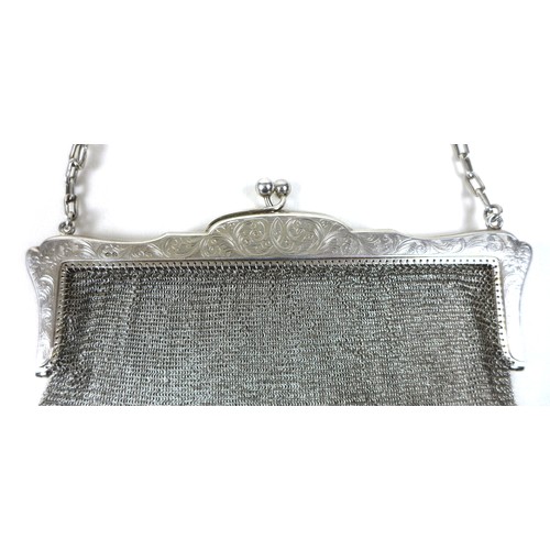 70 - An early 20th century silver ladies chainmail bag, floral engraved frame with chainmail link bag and... 