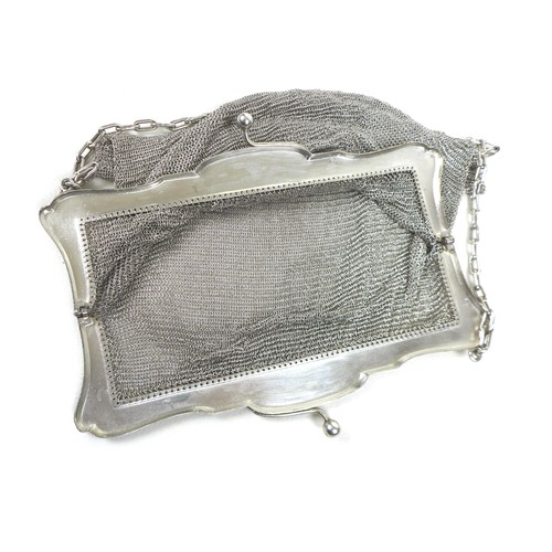 70 - An early 20th century silver ladies chainmail bag, floral engraved frame with chainmail link bag and... 