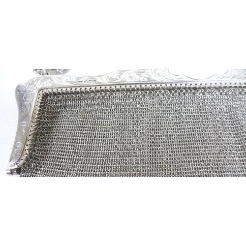 70 - An early 20th century silver ladies chainmail bag, floral engraved frame with chainmail link bag and... 