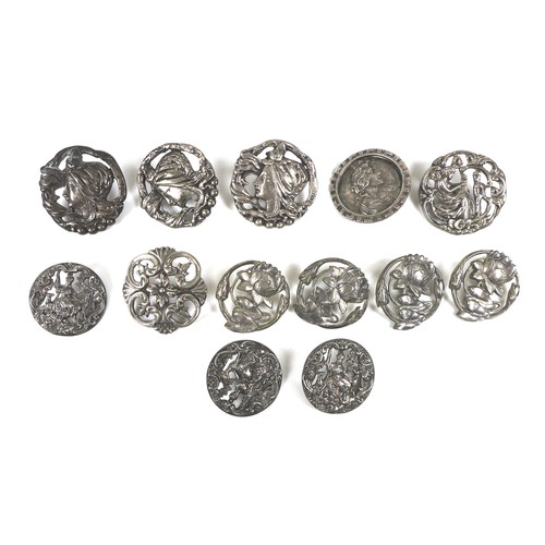 17 - A collection of thirteen silver buttons, together with a group of four white metal doll house furnit... 