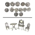 A collection of thirteen silver buttons, together with a group of four white metal doll house furnit... 