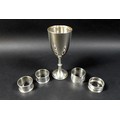 A group of silver items, comprising a Victorian silver goblet, rubbed marks, London 1887, and four s... 