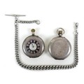 Two Victorian silver keyless wind pocket watches, both with brass crowns, comprising a half hunter, ... 
