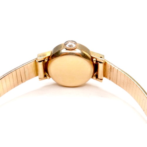 223 - An Omega 18K gold cased lady's wristwatch, circa 1960s, model 511.042, the circular champagne dial w... 