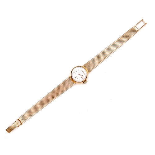 224 - An Omega 18K gold cased lady's wristwatch, circa 1970s, model 542.645, the circular gold dial with g... 