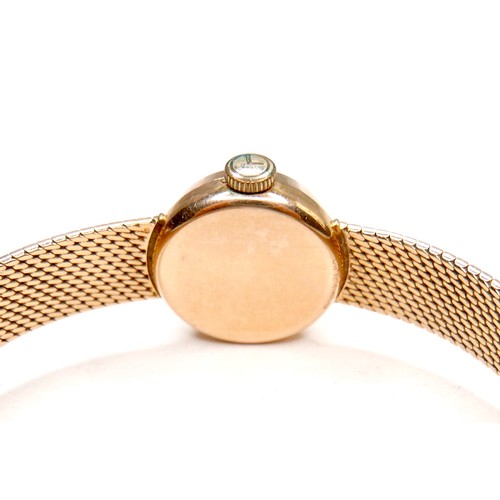 224 - An Omega 18K gold cased lady's wristwatch, circa 1970s, model 542.645, the circular gold dial with g... 