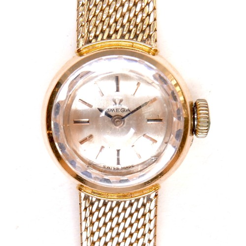 224 - An Omega 18K gold cased lady's wristwatch, circa 1970s, model 542.645, the circular gold dial with g... 